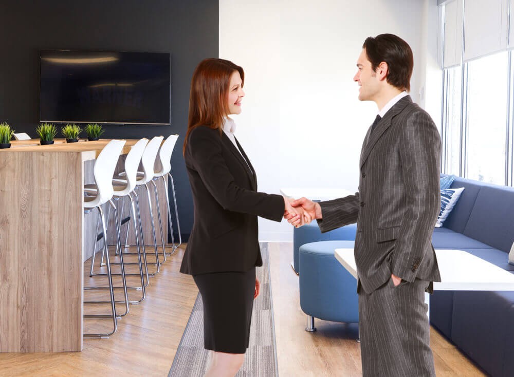 Two business people in a discussion.